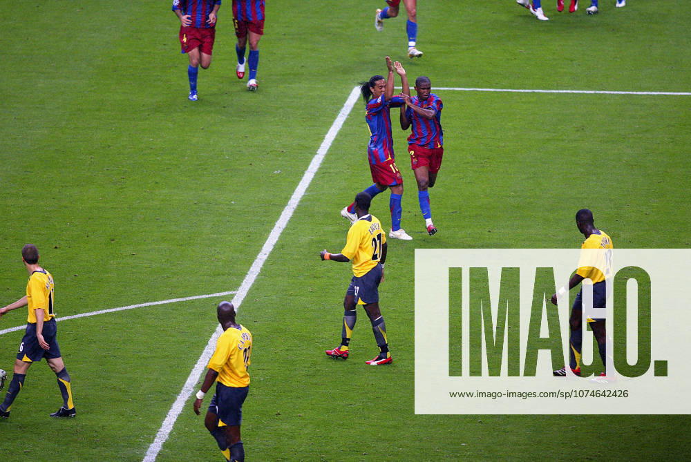 Barcelona V Arsenal, UEFA Champions League Final Ronaldinho of Barcelona and Samuel Eto o celebrate during the UEFA Champions League Final match between Barcelona and Arsenal at Stade De France on May 17, 2006 in Paris, France. Paris Stade De France France France