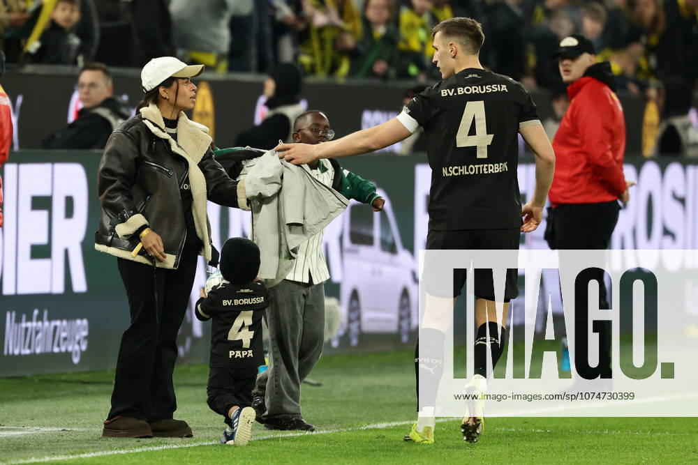Dortmund, Germany, 21 03 26, Nico Schlotterbecks Borussia Dortmund wife Sabrina with child and Nico Schlotterbeck Borussia Dortmund during the Bundesliga 1 match between Borussia Dortmund Hamburger SV at Signal Iduna Park in Dortmund Photo by Joachim Bywaletz DFB DFL REGULATIONS PROHIBIT ANY USE OF PHOTOGRAPHS AS IMAGE SEQUENCES AND OR QUASI VIDEO