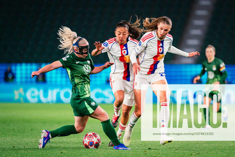 UWCL VfL Wolfsburg vs OL Lyonnes, 24 03 2026 Jule Brand OL Lyon, 29 and Selma Bacha OL Lyon, 4 vs Thea Bjelde VfL Wolfsburg, 2 UEFA Women s Champions League, quarter-final, first leg VfL Wolfsburg vs OL Lyonnes on 24 03 2026 at Volkswagen Arena, Wolfsburg DFB DFL REGULATIONS PROHIBIT ANY USE OF PHOTOGRAPHS AS IMAGE SEQUENCES AND OR QUASI VIDEO