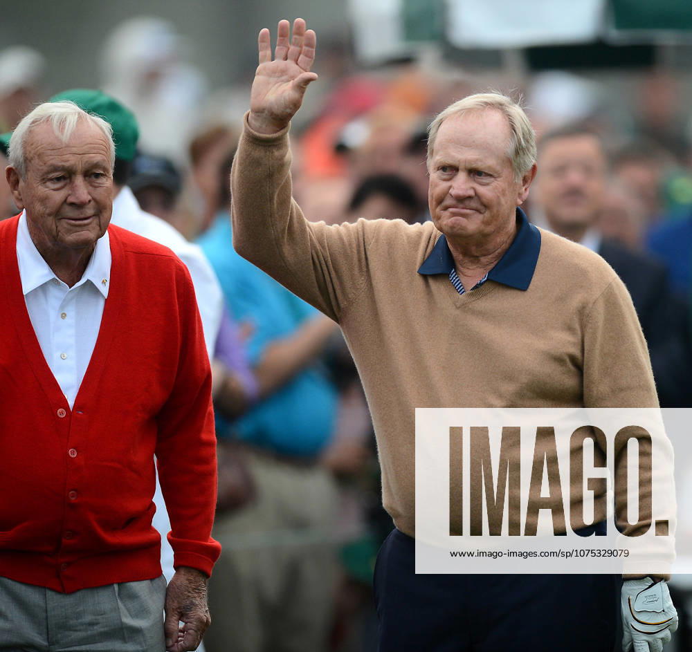 Augusta, GA, USA - Honorary starter Arnold Palmer, left, looks on as fellow starter Jack Nicklaus waves to the crowd. Palmer, Nicklaus and Gary Player each hit a drive from the first tee to begin the first round of the Masters Tournament at Augusta National Golf Club in Augusta, Georgia on Thursday