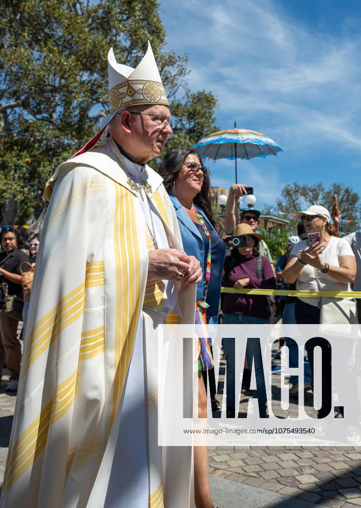 People and their pets line up in Olvera Street in Los Angeles to receive a blessing from Archbishop Jose Gomez in a Catholic tradition that celebrates St. Francis of Assisiâ€⠢s love of animals. This centuries-old tradition, usually held the Saturday before Easter, has been a part of Olvera Streetâ€⠢s history since 1930. Some people and there animals dress up, in this case, as Aztecs. Los Angeles USA - ZUMAh234 20260404_zsp_h234_006