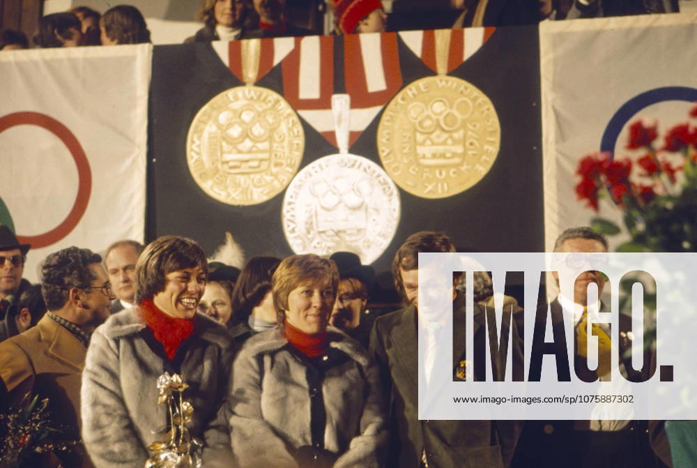 Olympic Winter Games in Innsbruck 1976 Rosi Mittermaier will at a Reception in Reit in Winkl celebrated Them is smiling with others Human Beings before a Wall decoration with Olympic Medals and Wrestling The Scene shows The Recognition their Benefits at the Olympic Winter Games 1976 Winkl Germany