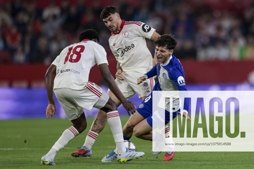 Sevilla FC v Atletico de Madrid - LaLiga EA Sports Rodrigo Mendoza of Atletico de Madrid competes for the ball with Luciem Agoume and Isaac Romero of Sevilla FC during the La Liga EA Sports match between Sevilla FC and Atletico de Madrid at Ramon Sanchez Pizjuan in Seville, Spain, on April 11, 2026. Seville Spain