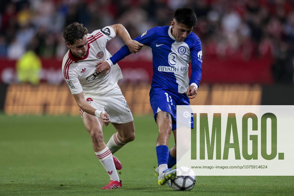 Sevilla FC v Atletico de Madrid - LaLiga EA Sports Thiago Almada of Atletico de Madrid competes for the ball with Manu Bueno of Sevilla FC during the La Liga EA Sports match between Sevilla FC and Atletico de Madrid at Ramon Sanchez Pizjuan in Seville, Spain, on April 11, 2026. Seville Spain