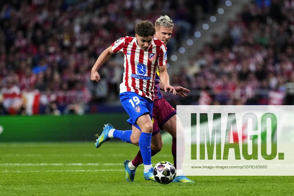SOCCER-Matchday Round of Quarter-finals of UEFA Champions League match between Atletico de Madrid and FC Barcelona, Barca at Riyadh Air Metropolitano on April 14, 2026. Julian Alvarez of Atletico de Madrid battles for the ball with Dani Olmo of FC Barcelona during the UEFA Champions League match between Atletico de Madrid and FC Barcelona at Riyadh Air Metropolitano on April 14, 2026. Madrid Madrid Spain