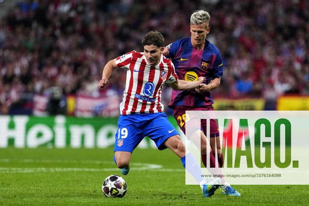 SOCCER-Matchday Round of Quarter-finals of UEFA Champions League match between Atletico de Madrid and FC Barcelona, Barca at Riyadh Air Metropolitano on April 14, 2026. Julian Alvarez of Atletico de Madrid battles for the ball with Dani Olmo of FC Barcelona during the UEFA Champions League match between Atletico de Madrid and FC Barcelona at Riyadh Air Metropolitano on April 14, 2026. Madrid Madrid Spain