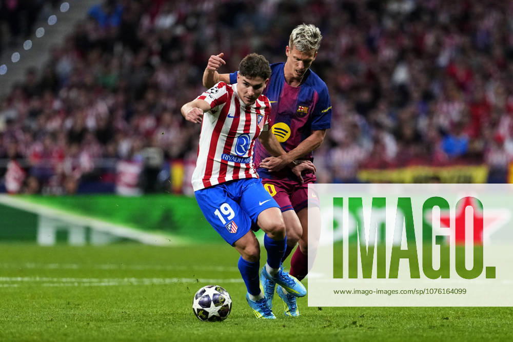 SOCCER-Matchday Round of Quarter-finals of UEFA Champions League match between Atletico de Madrid and FC Barcelona, Barca at Riyadh Air Metropolitano on April 14, 2026. Julian Alvarez of Atletico de Madrid battles for the ball with Dani Olmo of FC Barcelona during the UEFA Champions League match between Atletico de Madrid and FC Barcelona at Riyadh Air Metropolitano on April 14, 2026. Madrid Madrid Spain