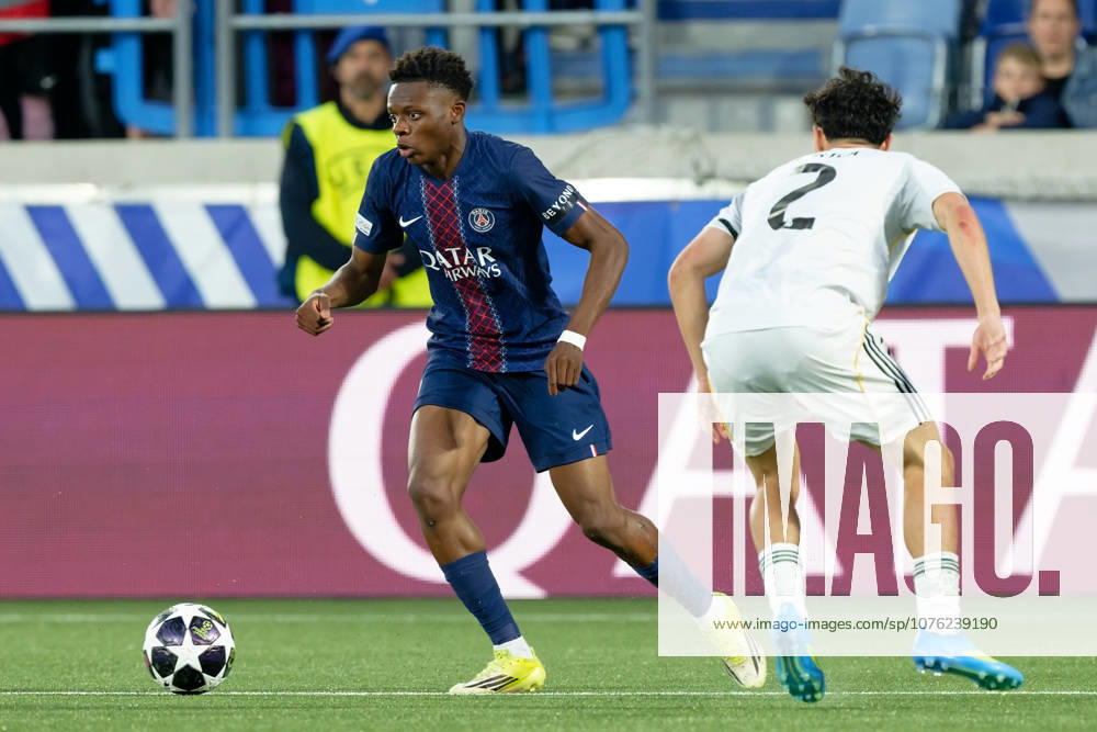 Lausanne, Switzerland - April 17 : Noah Nsoki of Paris in action (close up) under pressure of Jesus Fortea of Real Madrid during the UEFA Youth League semi-finals match between Real Madrid and Paris at Stade de la Tuilière on April 17 , 2026 in Lausanne, Switzerland.