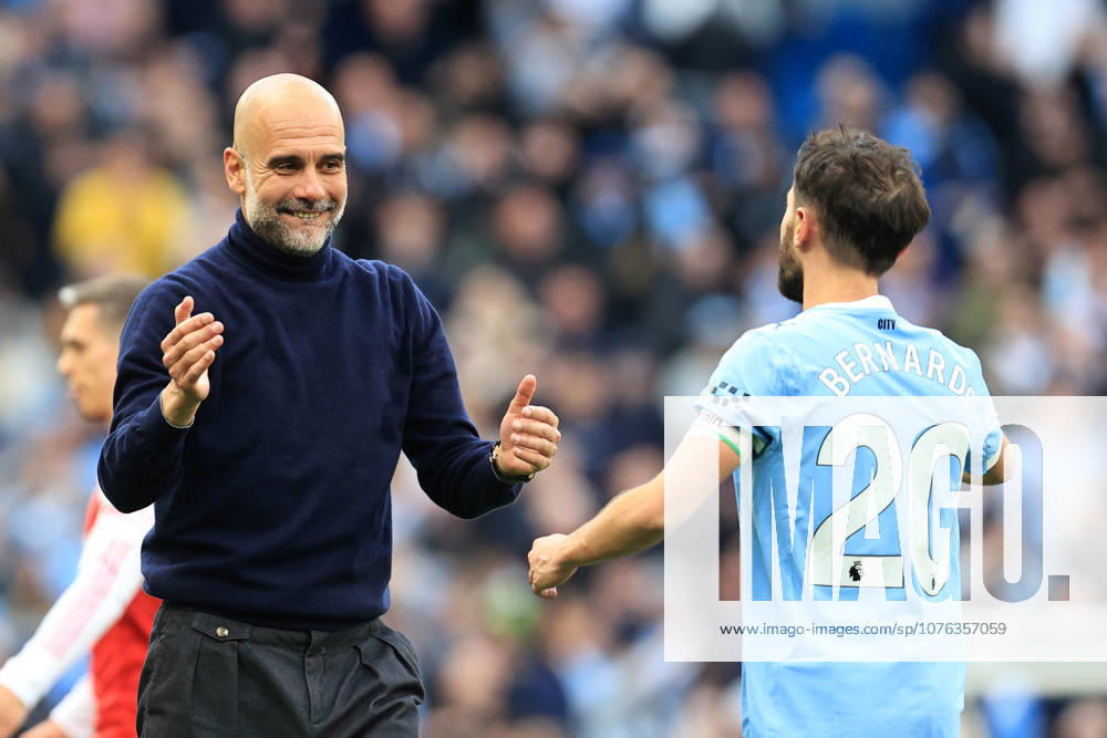 19th April 2026; Etihad Stadium, Manchester, Lancashire, England; Premier League Football, Manchester City versus Arsenal ; Manchester City manager Pep Guardiola celebrates with Bernardo Silva at full time DavidxBlunsden