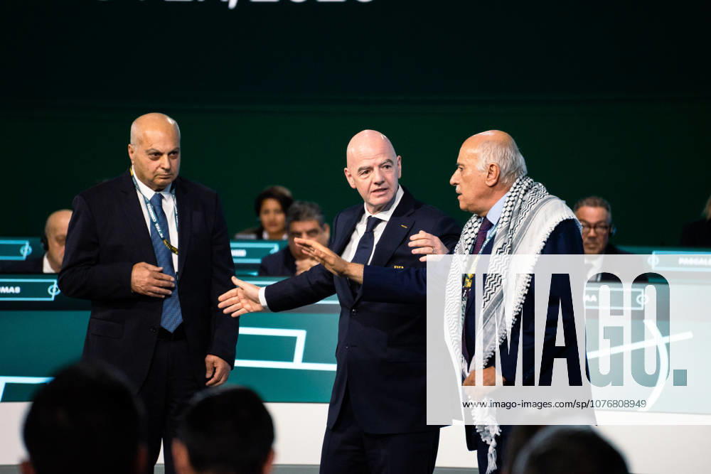 FIFA President Gianni Infantino attempts to ease tensions between Israel Football Association Vice President Basim Sheikh and Palestinian Football Association President Jibril Rajoub by asking them to take a photo together during the 76th FIFA Congress meeting at the Vancouver Convention Centre on April 30, 2026 in Vancouver, British Columbia, Canada.