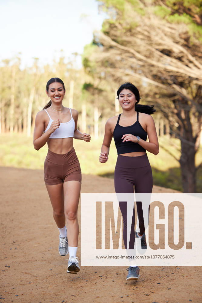 Fitness women or friends running in nature, forest or park for workout, exercise and cardio training together. Diversity athlete, sports or runner people outdoor jogging for body health and wellness. (License=RF) 19908761 ,model released, Symbolfoto