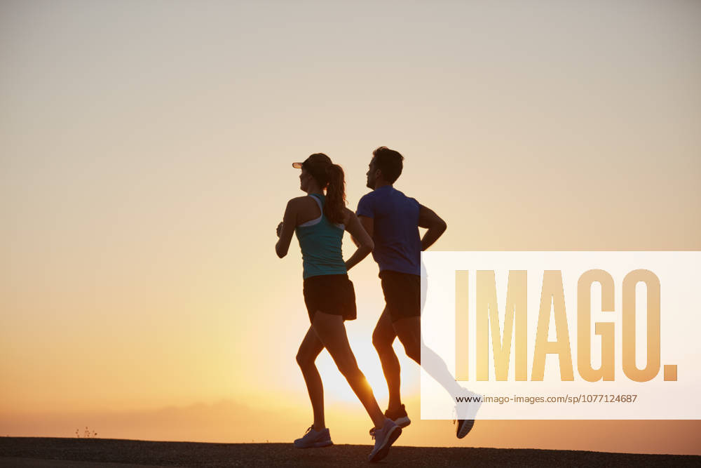Stop wishing and start doing. a silhouetted couple out for a run at sunrise (License=RF) 20059767 ,model released, Symbolfoto