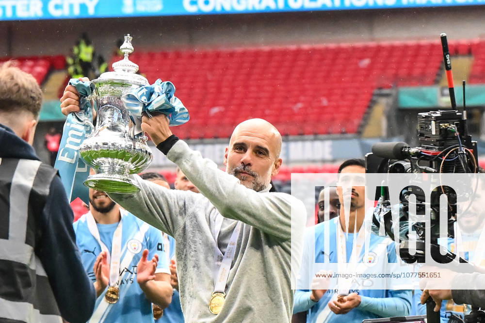 Chelsea v Manchester City - Emirates FA Cup Final Pep Guardiola, manager of Manchester City, holds the Emirates FA Cup during the Emirates FA Cup Final between Chelsea and Manchester City at Wembley Stadium in London on May 16, 2026. London Greater London United Kingdom