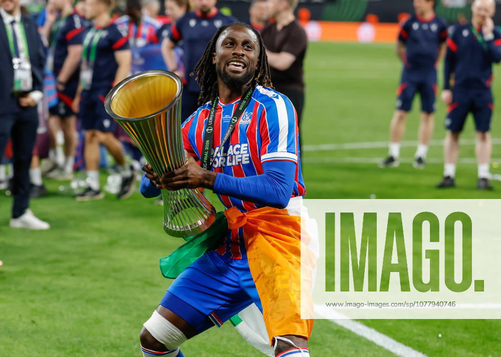Leipzig, Germany, 27th May 2026. Evann Guessand of Crystal Palace lifts the UEFA Conference League trophy following the Crystal Palace vs Rayo Vallecano UEFA Conference League Final match at Leipzig Stadium, Leipzig. Picture credit should read: Cody Froggatt Sportimage . SPI_101_CF_CRYSTAL_PALACE_V_RAYO_VALLECANO SPI-4827-0101