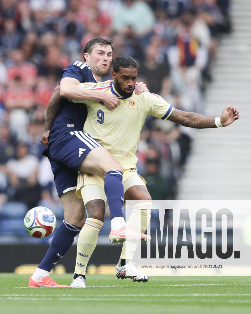 30th May 2026; Hampden Park, Glasgow, Scotland; Friendly International Football, Scotland versus Curacao; John Souttar of Scotland challenges for the ball with Jurgen Locadia of Curacao DavidxYoung