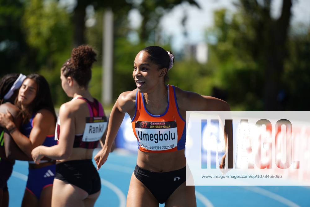 Joy Umegbolu 335 from Switzerland runs across the blue tartan track of the Michael Hoffmann Stadium in Mannheim with a beaming smile Timea Rankl 326, Switzerland can be seen in the background Joy Umegbolu 335 at the 32 Bauhaus Junior Gala in Mannheim