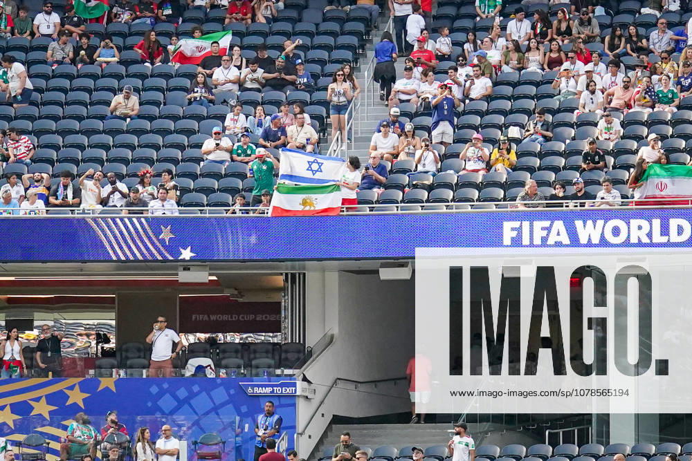 USA Soccer 2026 FIFA World Cup Group Stage Group G Iran vs. New Zealand SoFi Stadium, Inglewood, Los Angeles County, California Fans from the Iranian diaspora display historic Iranian flags featuring the lion and sun, as well as the Israeli national flag with the Star of David symbol, during the pitch inspection ahead of the 2026 FIFA World Cup group stage match between Iran and New Zealand at SoFi Stadium,detected_source_language