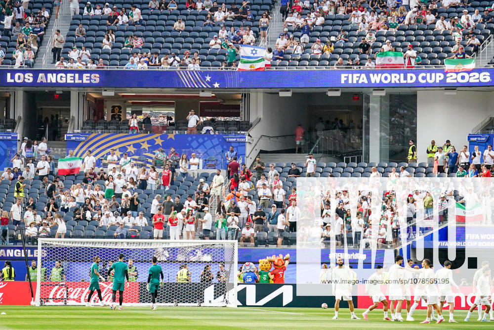 USA Soccer 2026 FIFA World Cup Group Stage Group G Iran vs. New Zealand SoFi Stadium, Inglewood, Los Angeles County, California Fans from the Iranian diaspora display historic Iranian flags featuring the lion and sun, as well as the Israeli national flag with the Star of David symbol, during the pitch inspection ahead of the 2026 FIFA World Cup group stage match between Iran and New Zealand at SoFi Stadium,detected_source_language