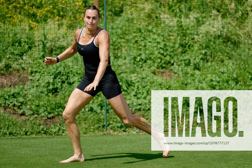 2026 Wimbledon, June 23, Practice LONDON, - JUNE 23: Aryna Sabalenka exercises with bare feet on the fresh grass during the 2026 Wimbledon, June 23, Practice at The all England club, Wimbledon on June 23, 2026 in London, GBR. London The all England club, Wimbledon GBR