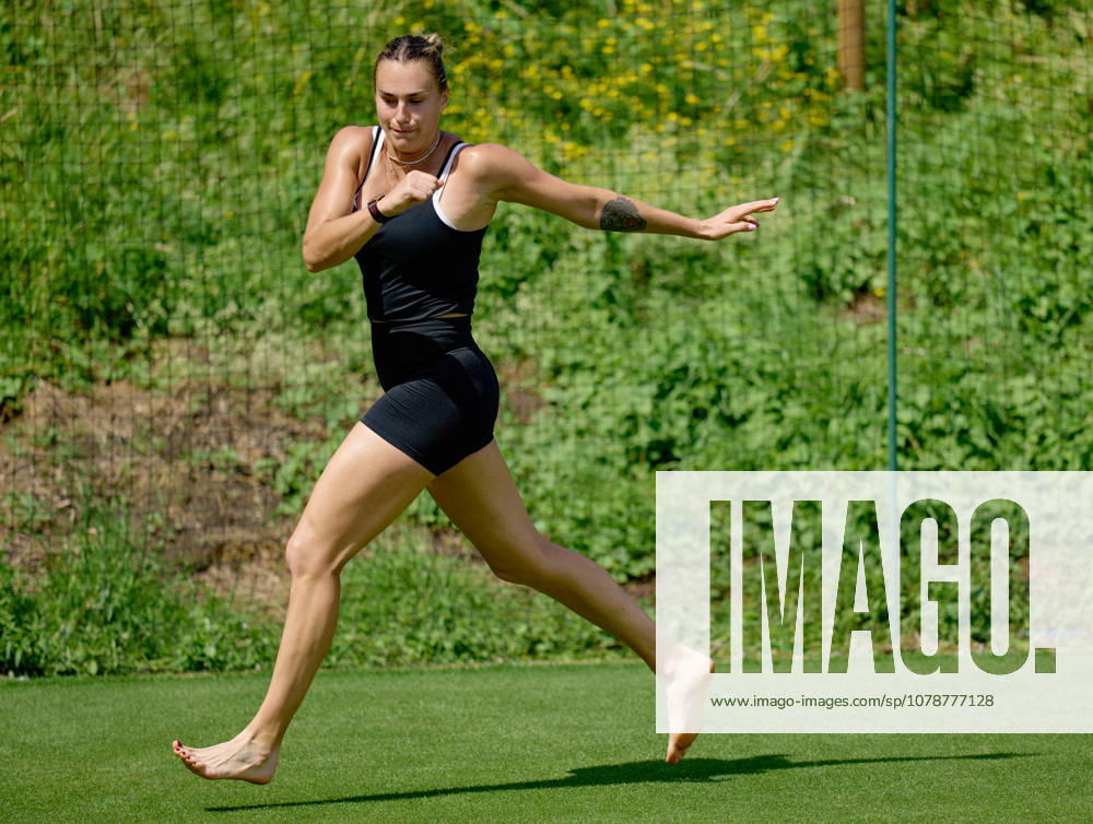 2026 Wimbledon, June 23, Practice LONDON, - JUNE 23: Aryna Sabalenka exercises with bare feet on the fresh grass during the 2026 Wimbledon, June 23, Practice at The all England club, Wimbledon on June 23, 2026 in London, GBR. London The all England club, Wimbledon GBR