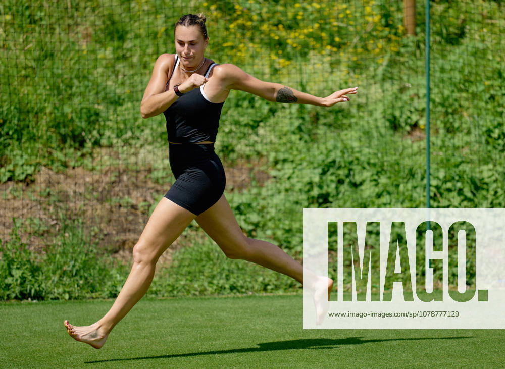 2026 Wimbledon, June 23, Practice LONDON, - JUNE 23: Aryna Sabalenka exercises with bare feet on the fresh grass during the 2026 Wimbledon, June 23, Practice at The all England club, Wimbledon on June 23, 2026 in London, GBR. London The all England club, Wimbledon GBR