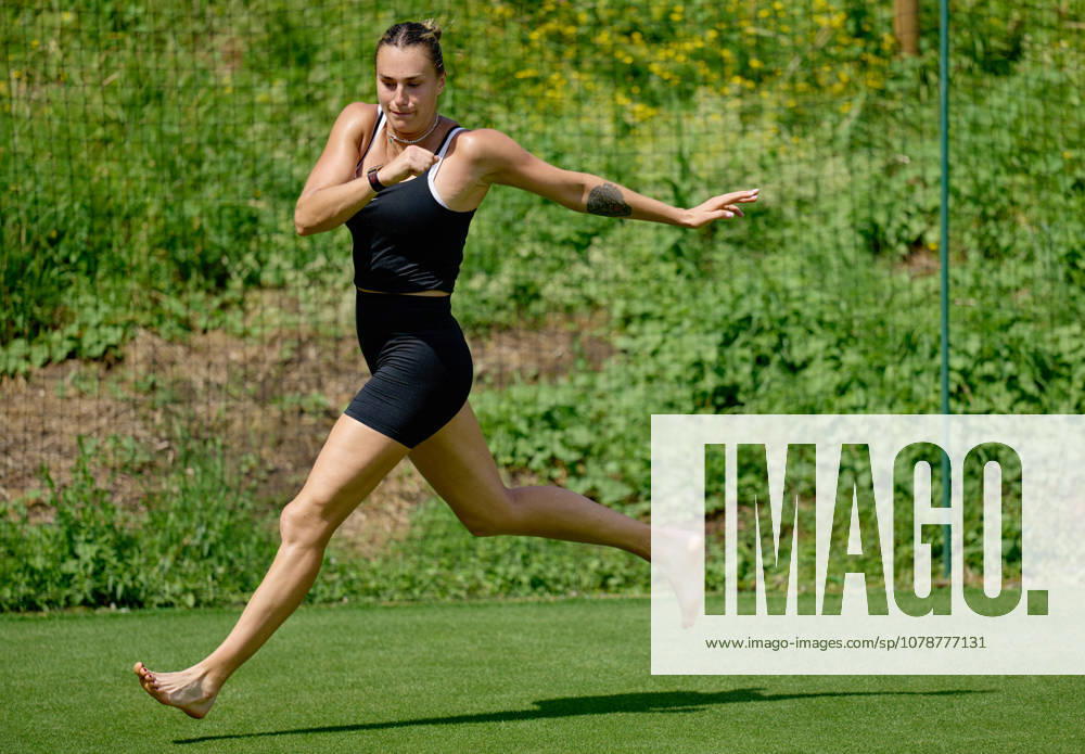 2026 Wimbledon, June 23, Practice LONDON, - JUNE 23: Aryna Sabalenka exercises with bare feet on the fresh grass during the 2026 Wimbledon, June 23, Practice at The all England club, Wimbledon on June 23, 2026 in London, GBR. London The all England club, Wimbledon GBR