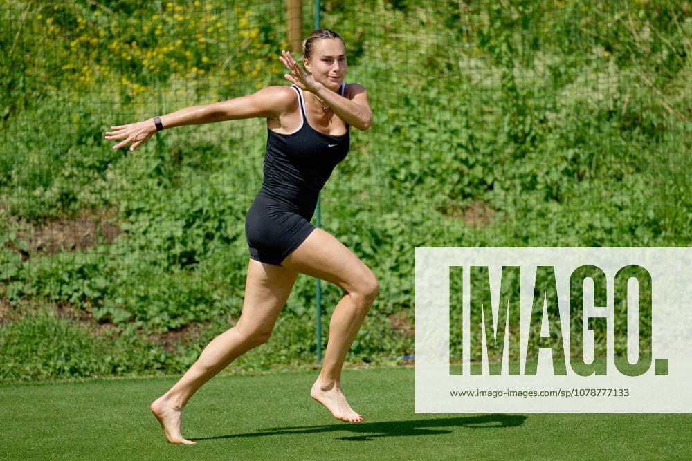 2026 Wimbledon, June 23, Practice LONDON, - JUNE 23: Aryna Sabalenka exercises with bare feet on the fresh grass during the 2026 Wimbledon, June 23, Practice at The all England club, Wimbledon on June 23, 2026 in London, GBR. London The all England club, Wimbledon GBR