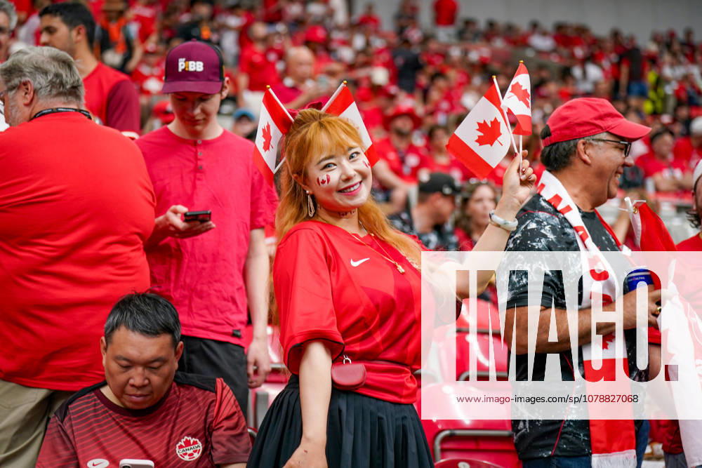 Canada Soccer 2026 FIFA World Cup Group Stage: Switzerland vs. Canada at BC Place Stadium in Vancouver, British Columbia; Canadian soccer fans, Fan portrait, female fan, Canadian flags, Canadian national flag, face paint, fan merchandise, fan culture, soccer enthusiasm, spectators, bleachers, stadium atmosphere, red and white clothing, supporters, fans, emotions, smiles, celebratory mood, public viewing atmosphere, sporting event, international audience, World Cup atmosphere, soccer fans, close-up, portrait, Canadian female supporter, fan section, sports, leisure, event, crowd