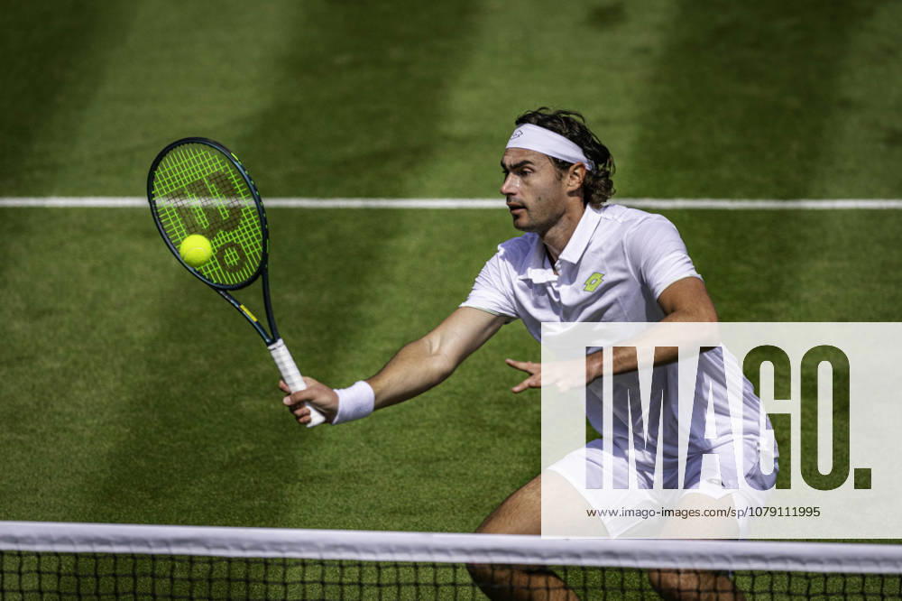 3rd July 2026; All England Lawn Tennis and Croquet Club, London, England; Wimbledon Tennis Tournament, Day Five; Patrik Trhac (USA) plays a volley in his second round match with Mac Kiger (USA) against Harri Heliovaara (FIN) and Henry Patten (GBR) GodfreyxPitt