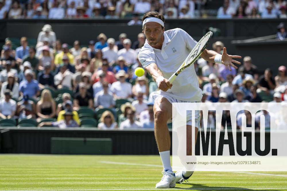 (260704) -- LONDON, July 4, 2026 -- Arthur Rinderknech of France returns the ball during the men s singles third round match against Novak Djokovic of Serbia at the Wimbledon Tennis Championships in London, Britain, on July 3, 2026. (Photo by Xinhua) (SP)BRITAIN-LONDON-TENNIS-WIMBLEDON-MEN S SINGLES StephenxChung