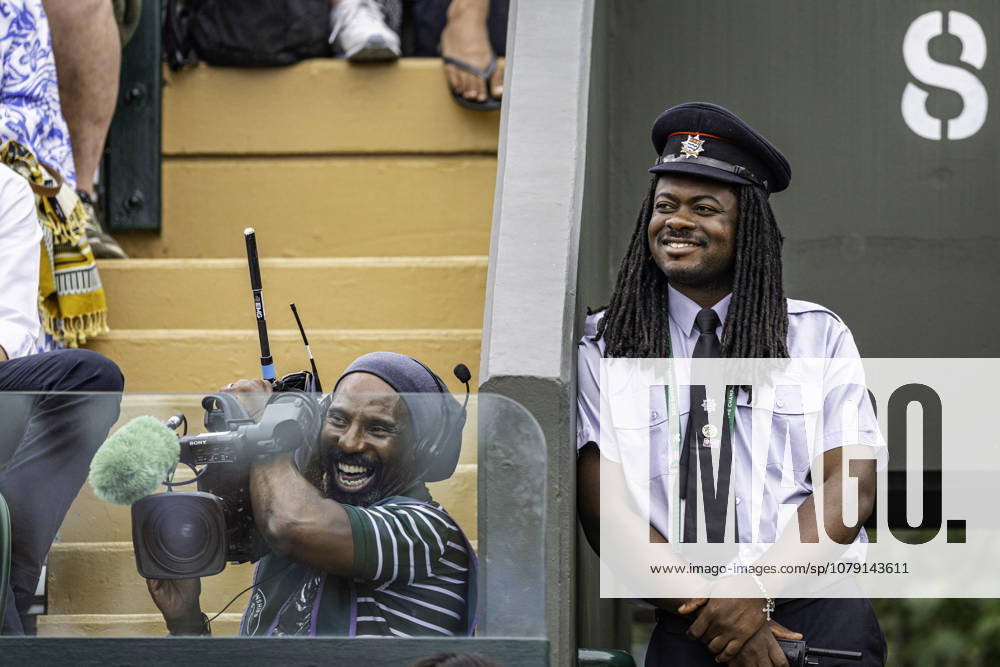 4th July 2026; All England Lawn Tennis and Croquet Club, London, England; Wimbledon Tennis Tournament, Day Six; A steward and cameraman enjoy the action on court GodfreyxPitt