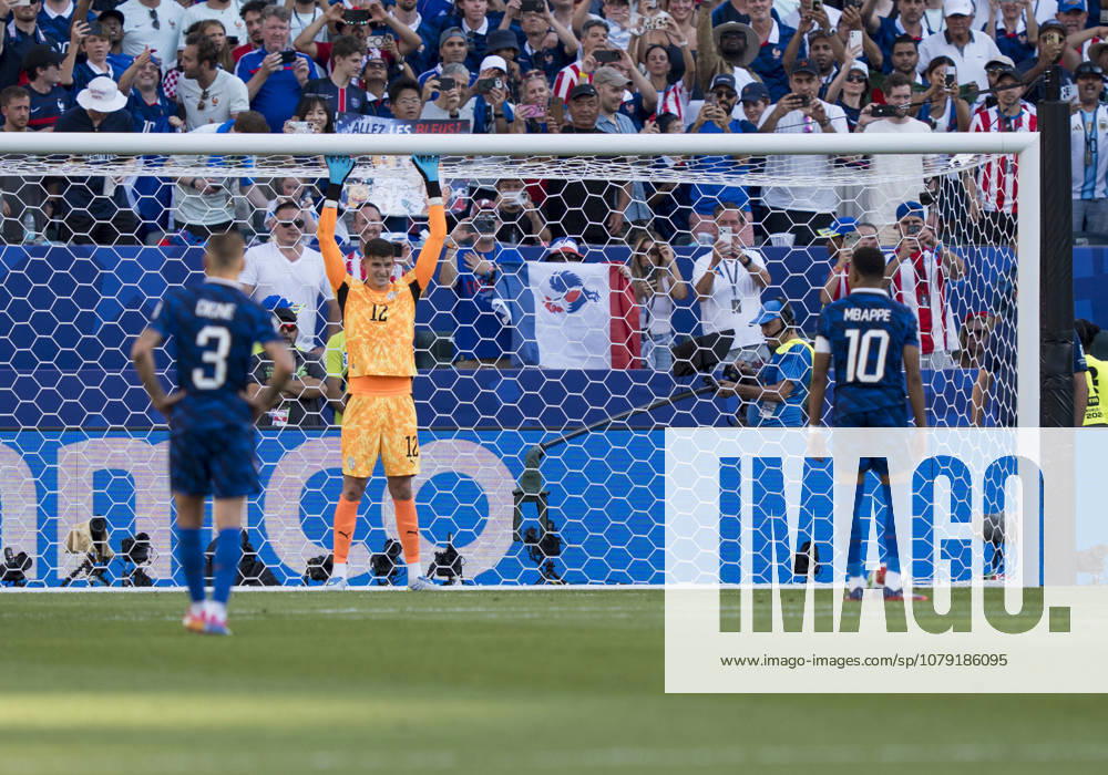 Kylian Mbappé of France, No. 10, prepares to take a penalty kick against Orlando Gil of Paraguay, No. 12, in the 2026 FIFA World Cup match between Paraguay and France on July 4, 2026. The Round of 16 match took place at Philadelphia Stadium in Philadelphia, Pennsylvania, USA.