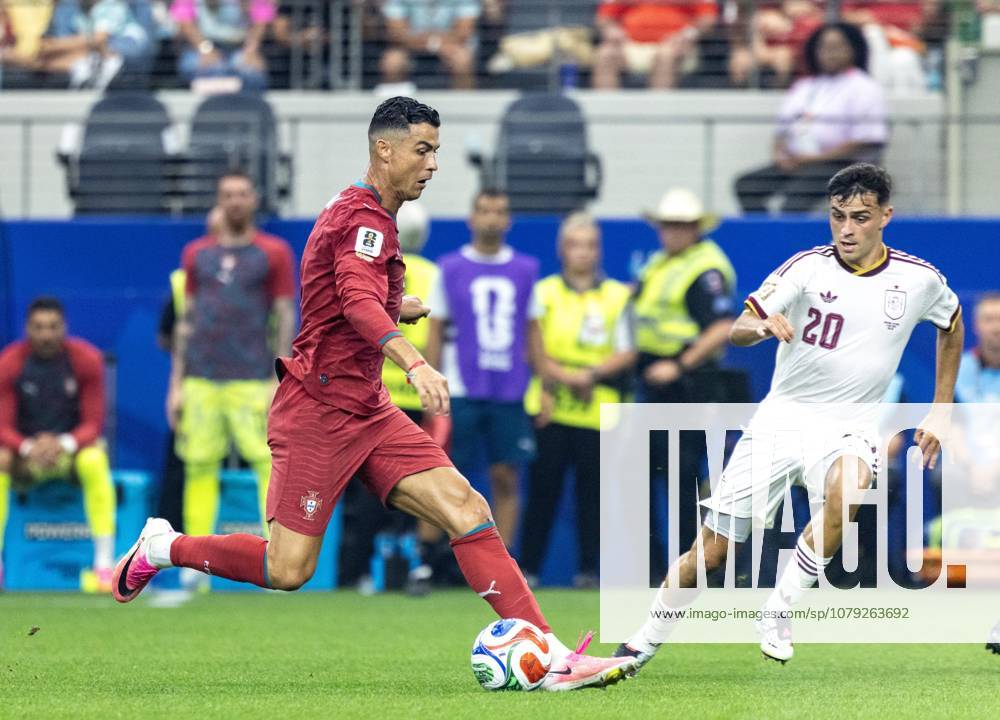 ARLINGTON, TEXAS- JULY 06: Cristiano Ronaldo of Portugal and Pedri of Spain compete for the ball during the FIFA World Cup, WM, Weltmeisterschaft, Fussball 2026 Round of 16 match between Portugal and Spain at Dallas Stadium on July 6, 2026 in Arlington, Texas.