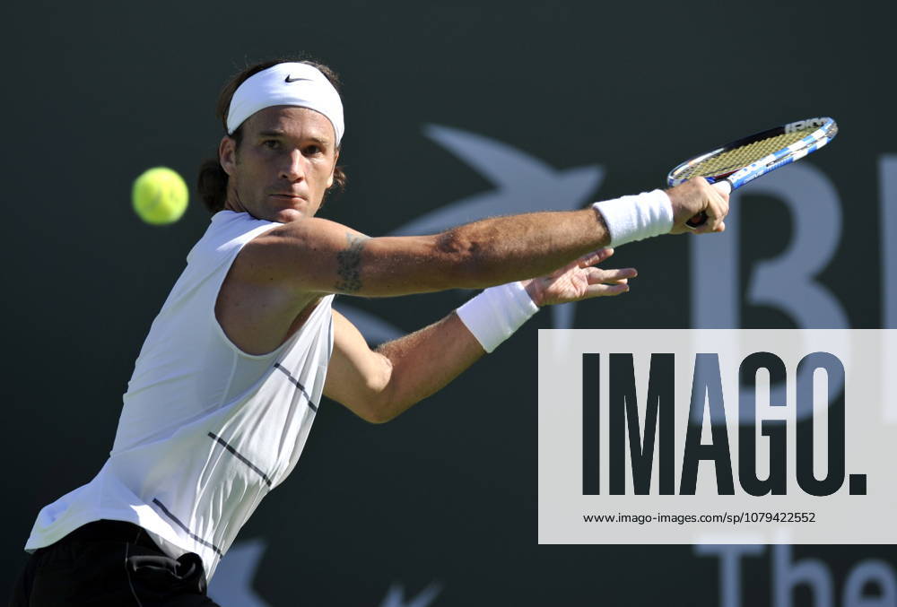 USA TENNIS BNP PARIBAS OPEN Carlos Moya epa02075761 Carlos Moya of Spain sets-up for a backhand slice against Tim Smyczek of the USA at the BNP Paribas Open tennis tournament in Indian Wells, California, USA, 11 March 2010. INDIAN WELLS United States