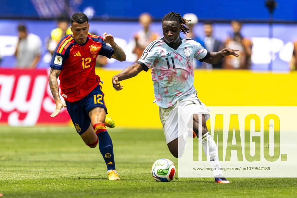 Spain Vs. Belgium FIFA World Cup, WM, Weltmeisterschaft, Fussball quarterfinal soccer match in Los Angeles, USA - 10 Jul 2026 Spain’s Pedro Porro (12) nd Belgium s Jérémy Doku (11) seen in action during the FIFA World Cup quarterfinal soccer match at SoFi Stadium. Los Angeles United States