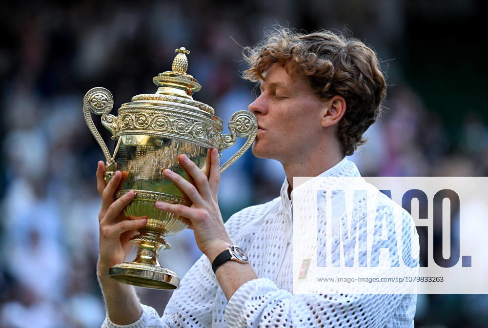 (260713) -- LONDON, July 13, 2026 -- Jannik Sinner of Italy kisses his trophy after winning the men s singles final against Alexander Zverev of Germany at the Wimbledon Tennis Championships in London, Britain, July 12, 2026. ) (SP)BRITAIN-LONDON-TENNIS-WIMBLEDON-MEN S SINGLES LixYing