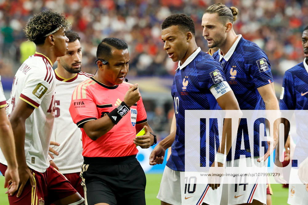 France v Spain: Semi Final - FIFA World Cup, WM, Weltmeisterschaft, Fussball 2026 Kylian Mbappe of France complains to referee Ivan Barton as Adrien Rabiot of France is shown a Yellow card and booked during the FIFA World Cup 2026 Semi Final match between France and Spain at Dallas Stadium on July 14, 2026 in Arlington, United States. Arlington Dallas Stadium TX United States