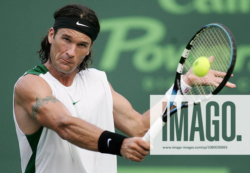 USA TENNIS NASDAQ-100 OPEN NASDAQ-100 OPEN epa00674796 Carlos Moya of Spain returns the ball to Victor Haneschu of Romania during their first round match at the the NASDAQ-100 Open in Key Biscayne. Florida Wednesday, 22 March 2006. Miami United States
