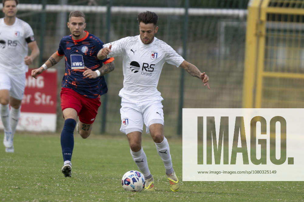 NOFV Oberliga South Season 26–27: VfL Halle 96 vs. SG Barockstadt Fulda Lehnerz Friendly Match in Halle, Germany, July 22, 2026. Pictured from left, in a tackle: Eric Krogmann (VfL Halle) and Leon Pomnitz (Fulda). Halle Stadion am Zoo, Saxony-Anhalt, Germany