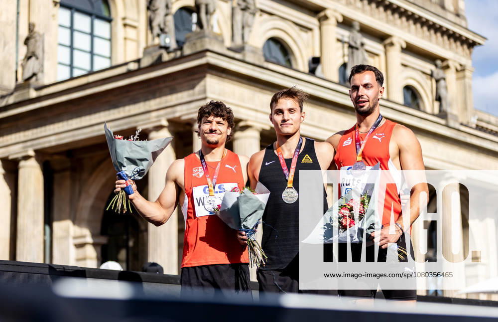 German Track and Field Championships—Men’s Pole Vault, Hanover, July 23, 2026. Celebrating together (from left): The medalists in the men’s pole vault—Fabio Wünsche (SC Potsdam e.V.), Marec Metzger (TSV Gräfelfing), and Constantin Rutsch (LG Olympia Dortmund). German Track and Field Championships, Men’s Pole Vault, on July 23, 2026, at Opernplatz in Hanover, Lower Saxony