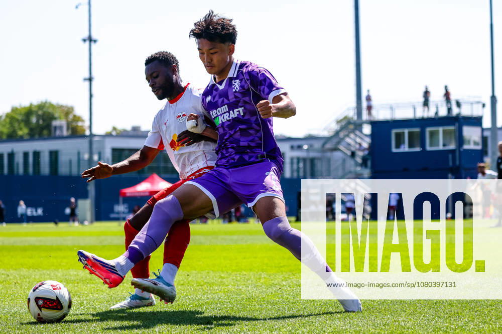 Tackle, duel, battle: Ridle Baku (RB Leipzig, 17) and Jongmin Seo (FC Ingolstadt, 07) go for the ball, RB Leipzig vs. FC Ingolstadt, soccer, friendly match, 2026–27 season, July 25, 2026,¨ RB Leipzig vs. FC Ingolstadt, soccer, friendly match, 2026–27 season, July 25, 2026, Leipzig