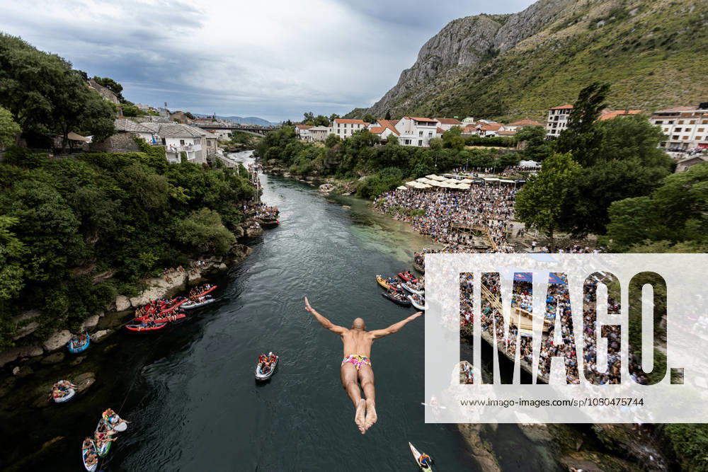 Mostar Old Bridge Diving Competition A participant dives from historical Old Bridge , also known as Mostar Bridge during the traditional diving competition event, 460th Traditional Mostar Old Bridge Diving Competition, in Mostar, Bosnia and Herzegovina on July 26, 2026. Each year, thousands of spectators watch the event across the Old Bridge that crosses Neretva river. DenisxKapetanovic PIXSELL