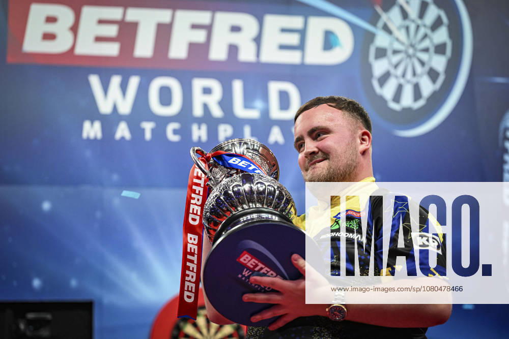 26th July 2026, Winter Gardens, Blackpool, Lancashire, England; 2026 Betfred World Matchplay Darts, Mens, Final Day; Luke Littler celebrates winning his final match against Gerwyn Price and holds the Betfred World Matchplay trophy GodfreyxPitt