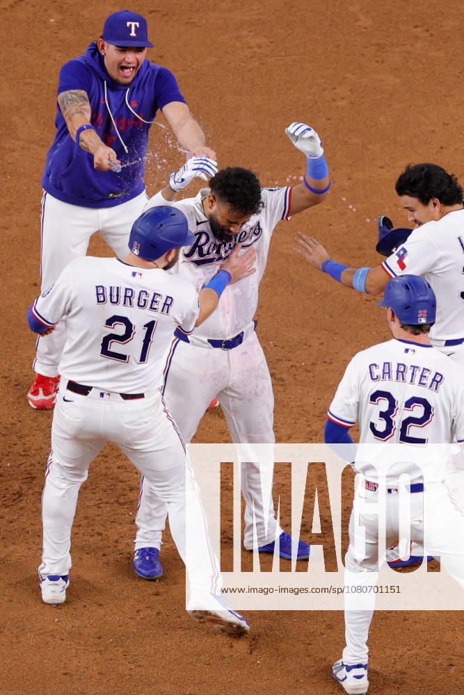 Texas Rangers third baseman EZEQUIEL DURAN (20) gets a drink shower after hitting the walk-off winner in a baseball game, Tuesday, Aug. 4, 2026, in Arlington, Texas. Arlington USA - ZUMAa325 20260804_zsa_a325_002