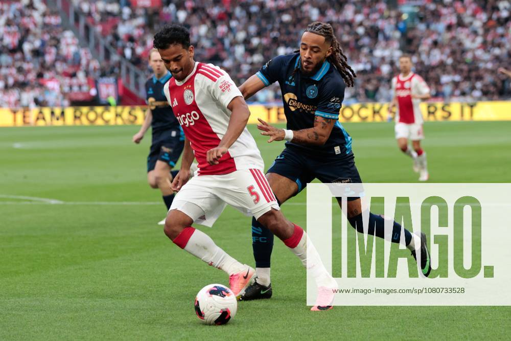 AMSTERDAM , 06-08-2026, Johan Cruijff ArenA , season 2026 2027 , UEFA Conference League play-off football . Match between Ajax and Shelbourne FC , Picture shows Ajax player Owen Wijndal, Shelbourne FC player Milan Mbeng Ajax - Shelbourne x205489018x