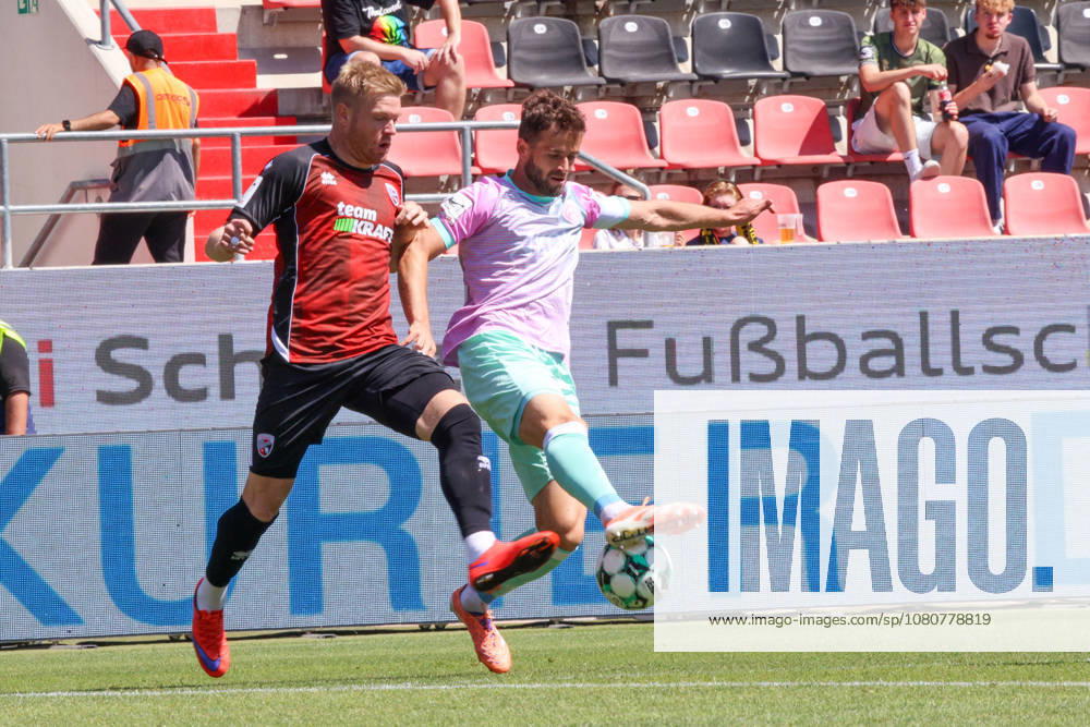 Tackle between Lars Lokotsch of FC Ingolstadt 04 (No. 13) and Daniel Haegele of Würzburger Kickers (No. 22) during the match between FC Ingolstadt 04 and Würzburger Kickers on August 8, 2026, DFB regulations prohibit any use of photographs as image sequences and or quasi-video. GER, Soccer, 3. Liga, Matchday 1, FC Ingolstadt 04 vs. Würzburger Kickers, August 8, 2026, Audi Sportpark Ingolstadt