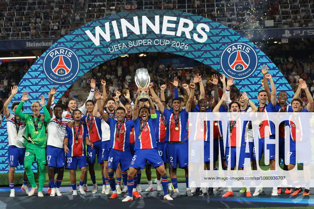 Paris Saint Germain v Aston Villa - UEFA Super Cup - Stadio Salzburg Salzburg, Austria, 12th August 2026. Paris Saint-Germain players; Marquinhos, Achraf Hakimi, Lucas Beraldo, Illia Zabarnyi, Khvicha Kvaratskhelia, Fabian Ruiz, Ousmane Dembele, Maghnes Akliouche, Lucas Digne, Desire Doue, Vitinha, Lucas Hernandez, Senny Mayulu, Nuno Mendes, Dro Fernandez, Bradley Barcola, Warren Zaire-Emery, Quentin Ndjantou Mbitcha, Ibrahim Mbaye, Willian Pacho and Joao Neves and Head Coach Luis Enrique celebrate with the trophy following the 2-1 victory in the Paris Saint Germain vs Aston Villa UEFA Super Cup match at Stadion Salzburg, Salzburg. Picture credit should read: Jonathan Moscrop Salzburg Stadion Salzburg Austria