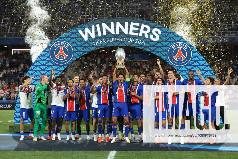 Paris Saint Germain v Aston Villa - UEFA Super Cup - Stadio Salzburg Salzburg, Austria, 12th August 2026. Paris Saint-Germain players; Marquinhos, Achraf Hakimi, Lucas Beraldo, Illia Zabarnyi, Khvicha Kvaratskhelia, Fabian Ruiz, Ousmane Dembele, Maghnes Akliouche, Lucas Digne, Desire Doue, Vitinha, Lucas Hernandez, Senny Mayulu, Nuno Mendes, Dro Fernandez, Bradley Barcola, Warren Zaire-Emery, Quentin Ndjantou Mbitcha, Ibrahim Mbaye, Willian Pacho and Joao Neves and Head Coach Luis Enrique celebrate with the trophy following the 2-1 victory in the Paris Saint Germain vs Aston Villa UEFA Super Cup match at Stadion Salzburg, Salzburg. Picture credit should read: Jonathan Moscrop Salzburg Stadion Salzburg Austria