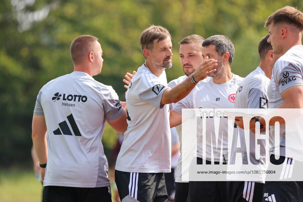 Herzogenaurach, Germany, August 16, 2026: Friendly match between Olympique Lyon Women and Eintracht Frankfurt Women. Pictured, from left: SGE assistant head coach Niko Arnautis high-fives teammates after the victory over Lyon.