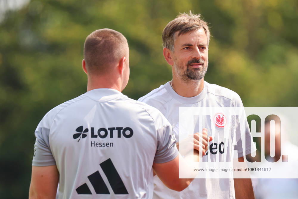 Herzogenaurach, Germany, August 16, 2026: Friendly match between Olympique Lyon Women and Eintracht Frankfurt Women. Pictured, from left: SGE assistant head coach Niko Arnautis high-fives teammates after the victory over Lyon.